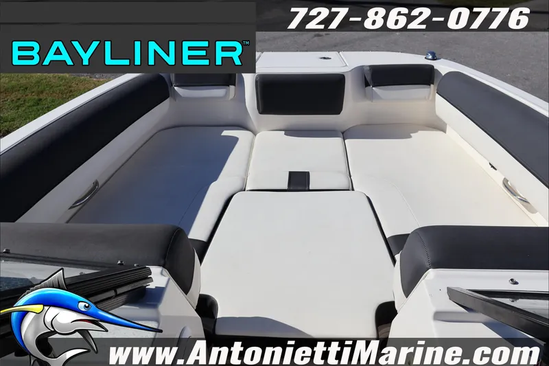 Slide: The Image of 2023 Bayliner DX 2000 boat interior with white seating, contact info, and Antonietti Marine logo. - 16