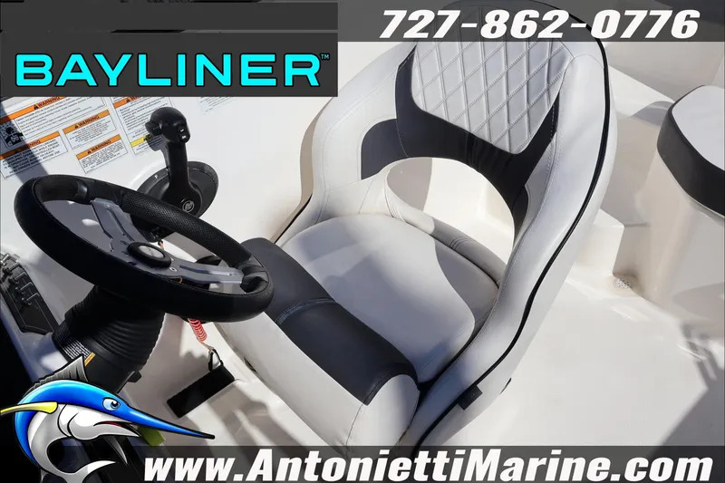 Slide: The Image of 2023 Bayliner DX 2000 boat interior with steering wheel and seat, Antonietti Marine branding. - 24
