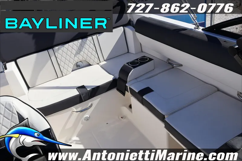 Slide: The Image of 2023 Bayliner DX 2000 boat interior with seating and cup holders, Antonietti Marine branding. - 25