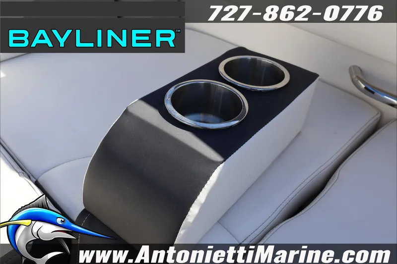 Slide: The Image of 2023 Bayliner DX 2000 boat interior with dual cup holders, featuring Antonietti Marine branding. - 26