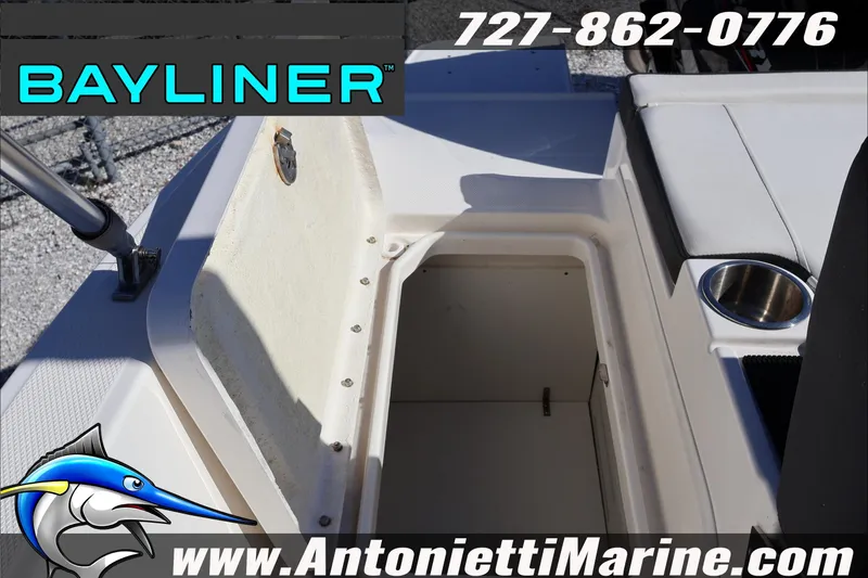 Slide: The Image of 2023 Bayliner DX 2000 boat storage compartment with cup holder, Antonietti Marine branding. - 30