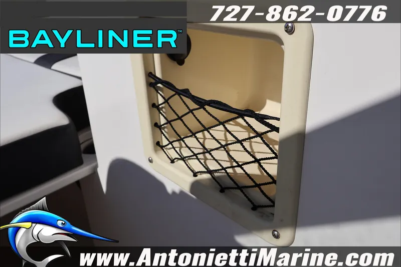 Slide: The Image of Bayliner DX 2000 boat storage compartment with netting, 2023 model. - 33