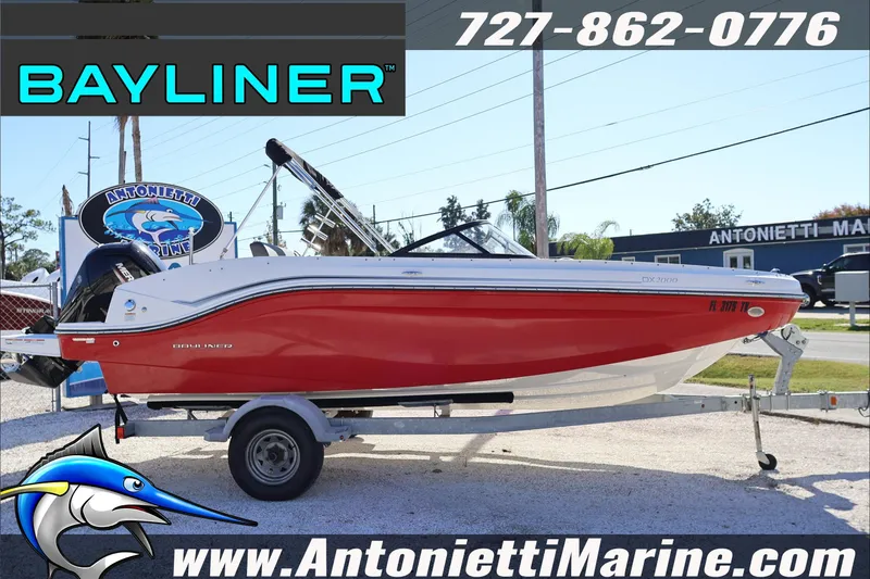 Slide: The Image of 2023 Bayliner DX 2000 boat in red on trailer at Antonietti Marine. - 5