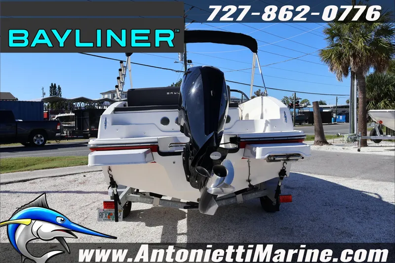 Slide: The Image of 2023 Bayliner DX 2000 boat rear view at Antonietti Marine dealership. - 6