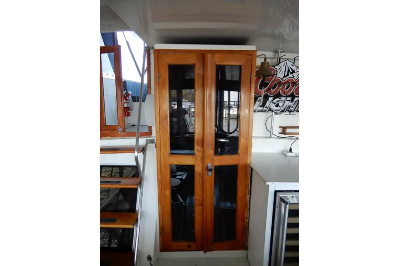 Slide: The Image of 1989 Jefferson 46 Sundeck interior with wooden doors and staircase. - 12