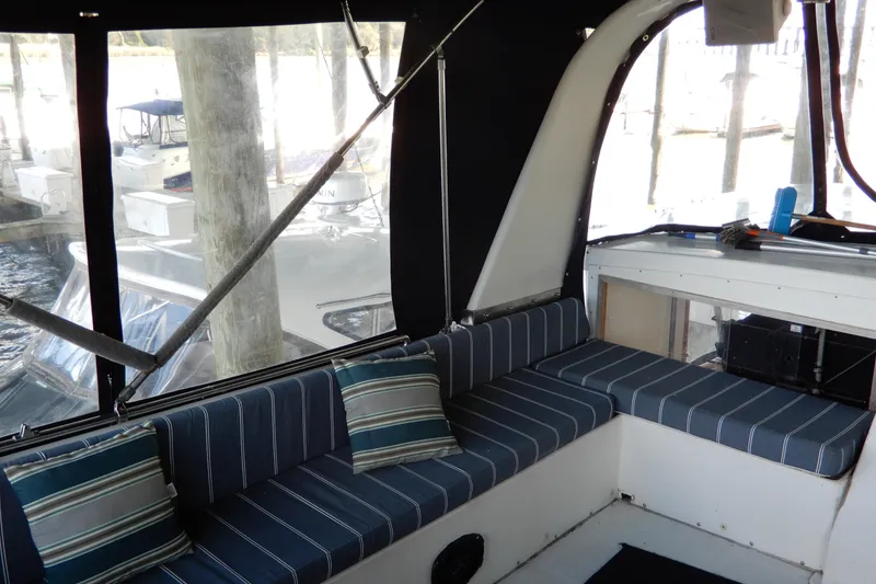 Slide: The Image of Interior of 1989 Jefferson 46 Sundeck yacht with striped seating and cushions. - 14
