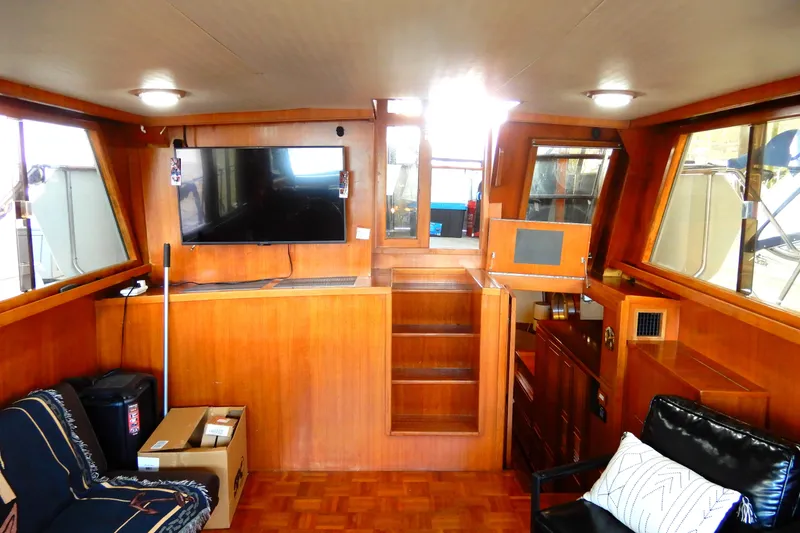 Slide: The Image of Interior of 1989 Jefferson 46 Sundeck yacht with wood paneling and modern amenities. - 26