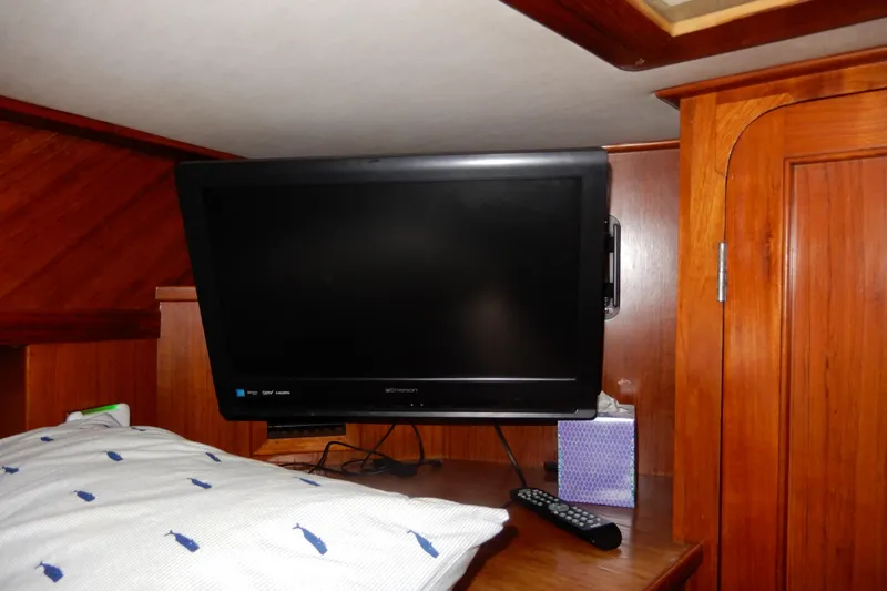 Slide: The Image of Flat-screen TV in the cabin of a 1989 Jefferson 46 Sundeck yacht. - 46