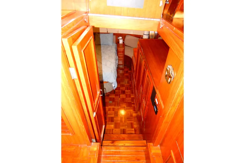 Slide: The Image of 1989 Jefferson 46 Sundeck interior with wooden cabinetry and cozy bedroom. - 50