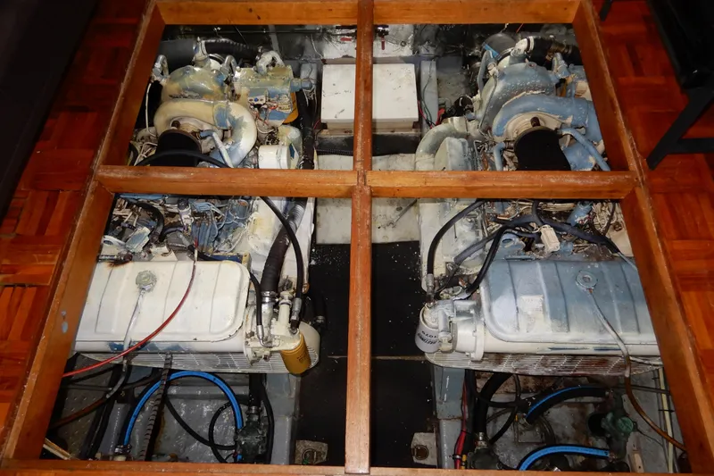 Slide: The Image of Engine room of a 1989 Jefferson 46 Sundeck boat, showcasing dual engines. - 60