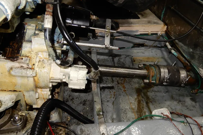 Slide: The Image of Engine room of a 1989 Jefferson 46 Sundeck boat, showing mechanical components and wiring. - 62