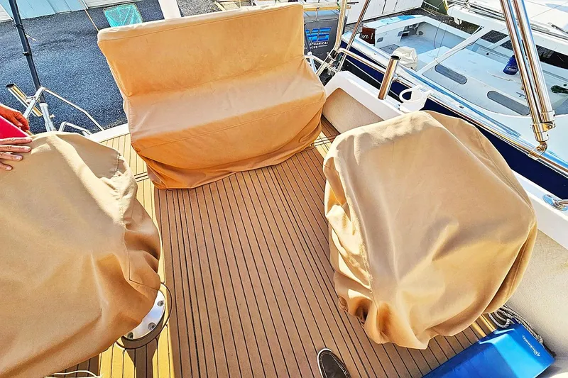 Slide: The Image of Deck of 2010 Eastern Casco Bay 35 with covered seating and teak flooring. - 10