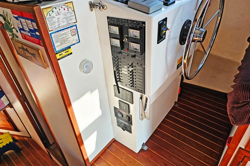 Slide: The Image of 2010 Eastern Casco Bay 35 boat helm with control panel and steering wheel. - 18
