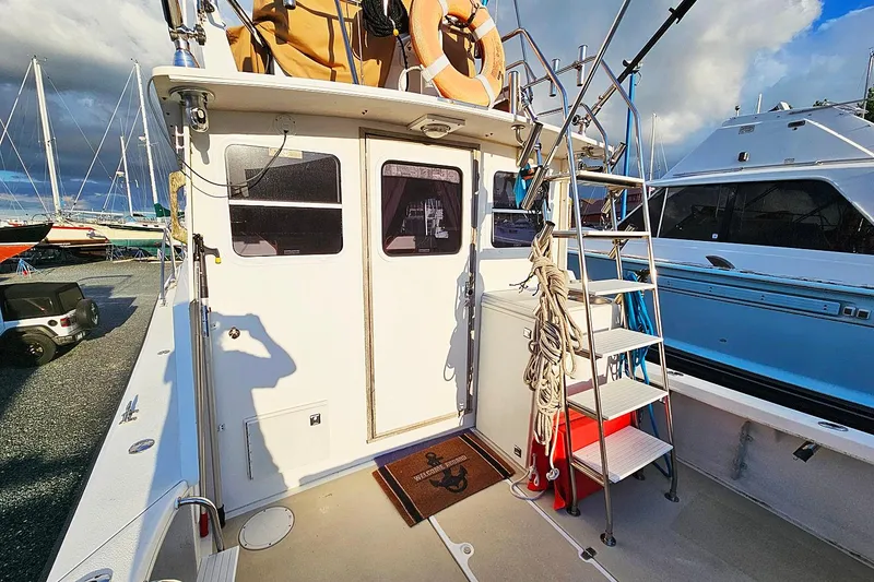 Slide: The Image of 2010 Eastern Casco Bay 35 boat deck with ladder and life preserver. - 4