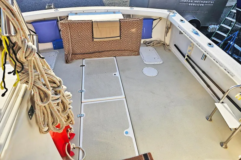 Slide: The Image of Spacious deck of 2010 Eastern Casco Bay 35 boat with ropes and seating. - 7