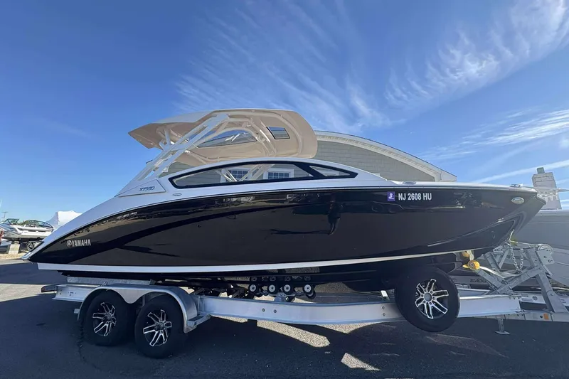 The Image of 2024 Yamaha 275 SD boat on trailer under clear blue sky. - 1