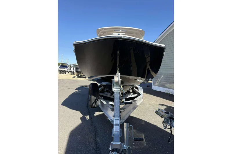 Slide: The Image of 2024 Yamaha 275 SD boat on trailer, front view, parked outdoors. - 4