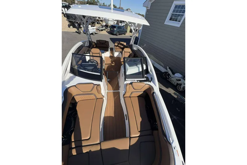 Slide: The Image of 2024 Yamaha 275 SD boat with sleek design and spacious seating. - 5