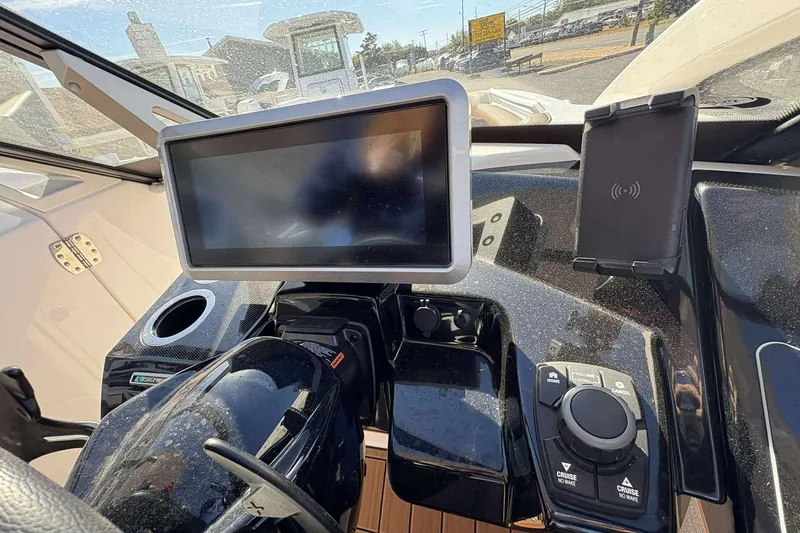 Slide: The Image of 2024 Yamaha 275 SD dashboard featuring touchscreen controls and navigation system. - 7