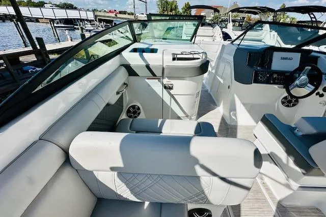 Slide: The Image of 2025 Sea Ray SDX 290 Outboard boat interior with modern seating and control panel. - 11