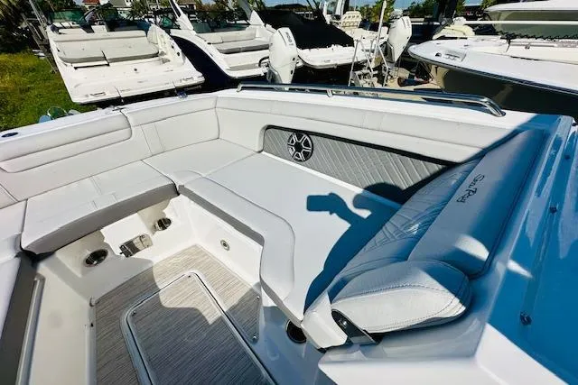 Slide: The Image of 2025 Sea Ray SDX 290 Outboard boat interior with luxurious seating and modern design. - 16