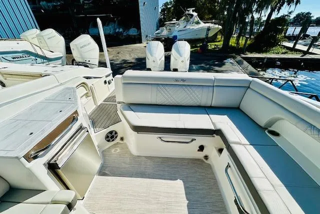 Slide: The Image of 2025 Sea Ray SDX 290 Outboard boat interior with spacious seating and modern amenities. - 6