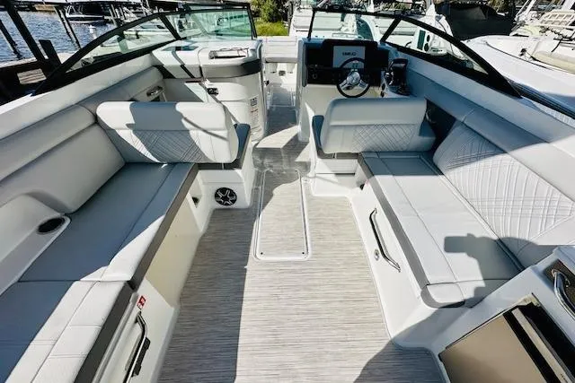 Slide: The Image of 2025 Sea Ray SDX 290 Outboard boat interior with spacious seating and modern design. - 9