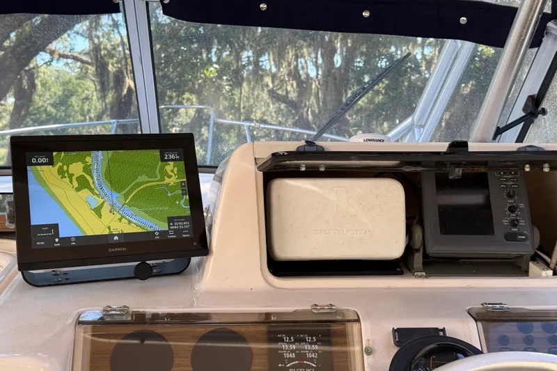 Slide: The Image of 1998 Grady-White Marlin 300 helm with Garmin navigation display and Furuno equipment. - 10