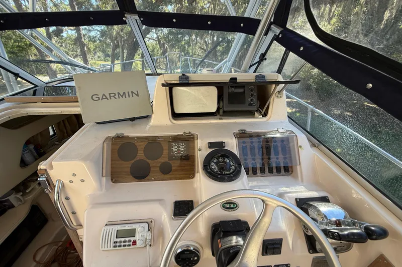 Slide: The Image of 1998 Grady-White Marlin 300 boat dashboard with Garmin navigation system. - 12