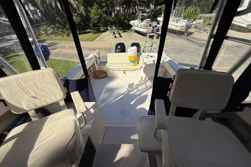 Slide: The Image of Interior view of a 1998 Grady-White Marlin 300 boat with seating and equipment. - 22