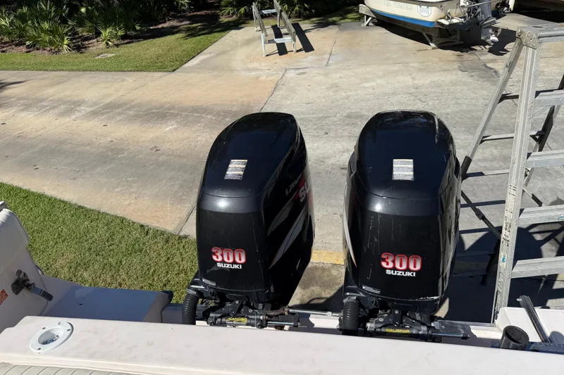Slide: The Image of Twin Suzuki 300 outboard engines on a 1998 Grady-White Marlin 300 boat. - 8