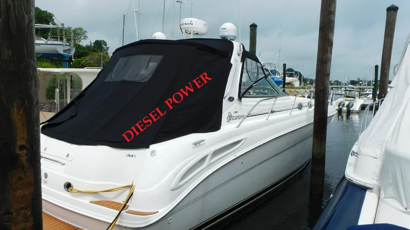 The Image of 2002 Sea Ray 380 Sundancer yacht docked, featuring "Diesel Power" cover. - 0