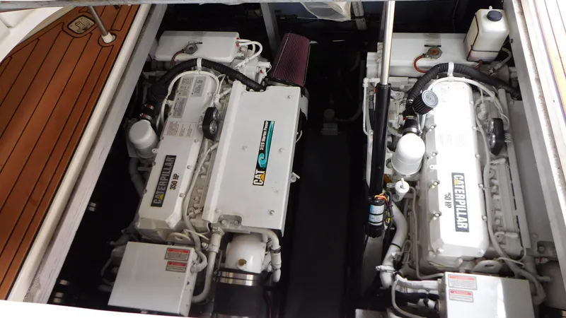 Slide: The Image of Engine compartment of a 2002 Sea Ray 380 Sundancer with twin Caterpillar engines. - 25
