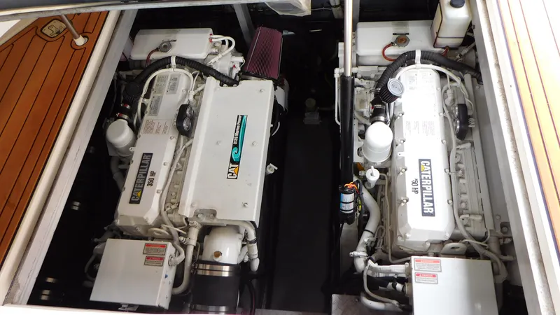 Slide: The Image of Engine compartment of a 2002 Sea Ray 380 Sundancer with twin Caterpillar engines. - 28
