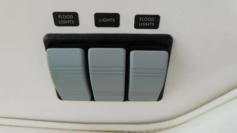Slide: The Image of Switch panel on a 2002 Sea Ray 380 Sundancer boat for flood and regular lights. - 30