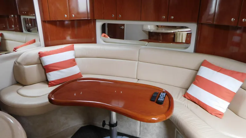 Slide: The Image of Luxurious 2002 Sea Ray 380 Sundancer interior with plush seating and striped cushions. - 33