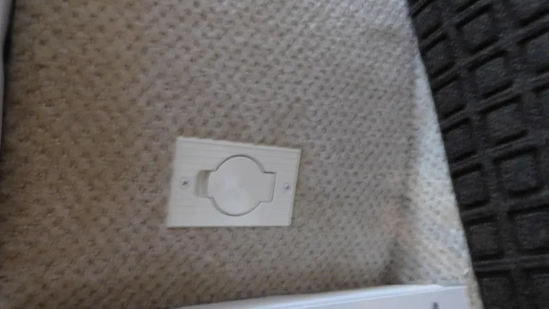 Slide: The Image of Power outlet on carpeted floor of 2002 Sea Ray 380 Sundancer boat. - 37