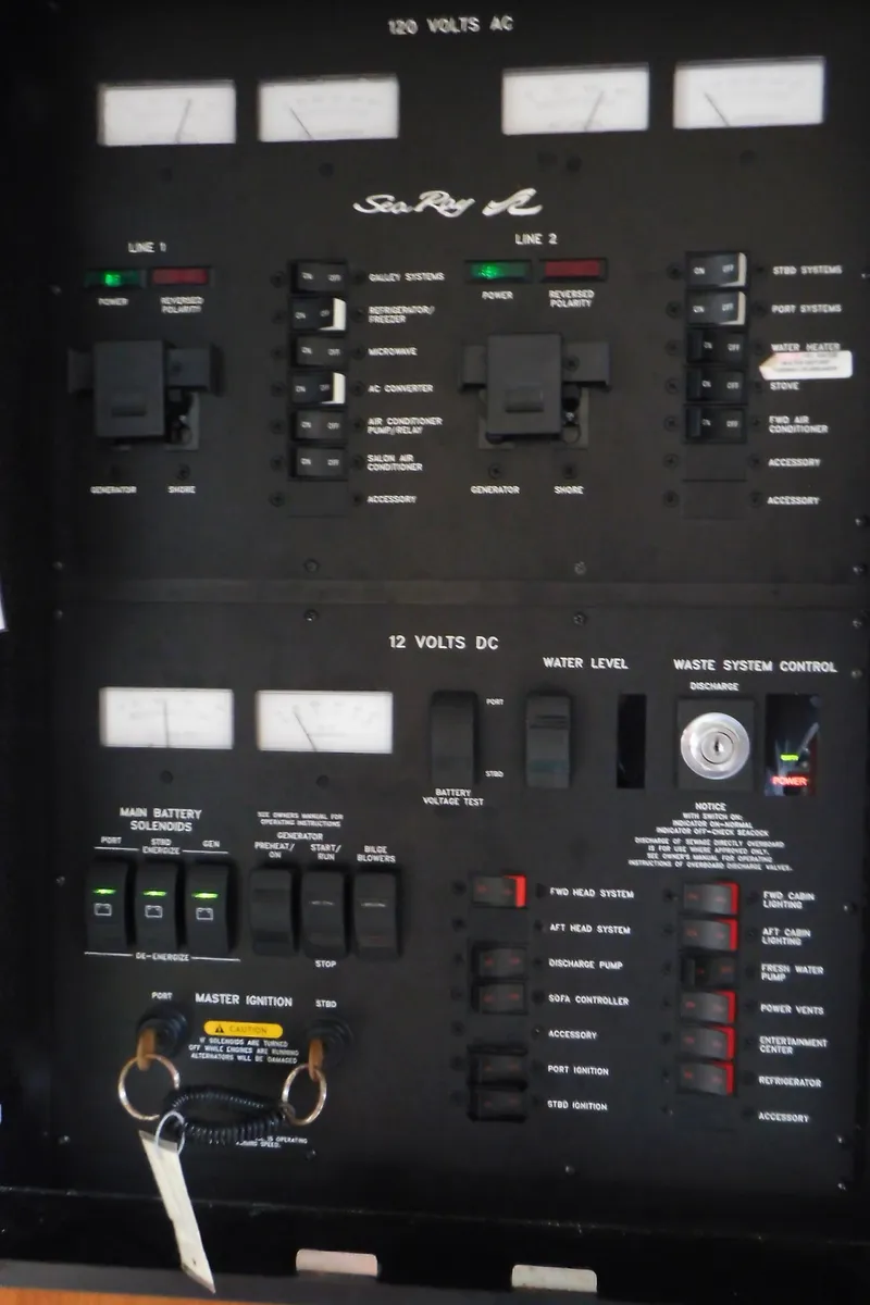 Slide: The Image of Electrical control panel of a 2002 Sea Ray 380 Sundancer boat. - 43