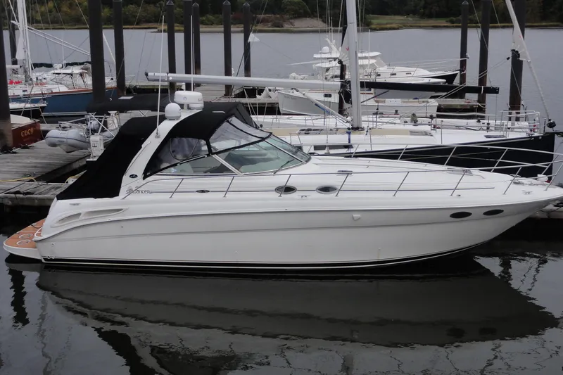 Slide: The Image of 2002 Sea Ray 380 Sundancer yacht docked at marina, side view. - 46