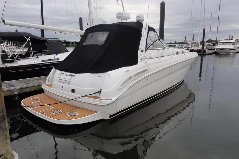 Slide: The Image of 2002 Sea Ray 380 Sundancer yacht docked in marina, rear view. - 47