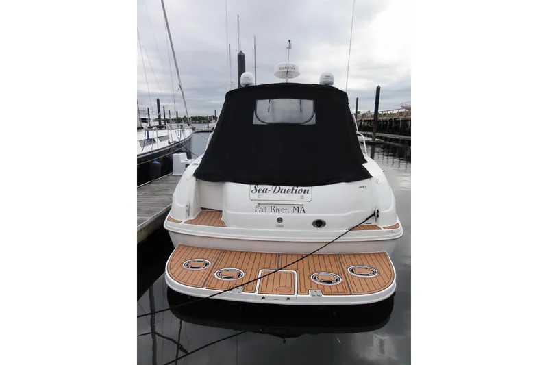 Slide: The Image of 2002 Sea Ray 380 Sundancer docked, rear view with black cover, Fall River, MA. - 48