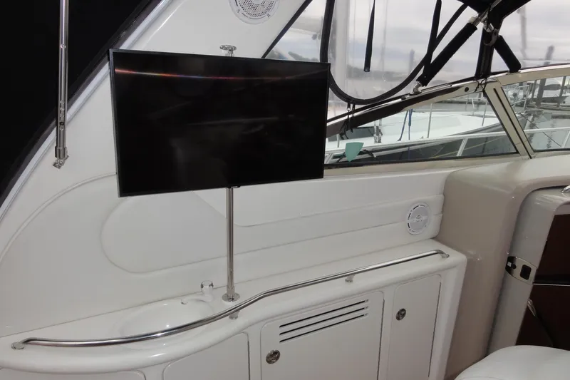 Slide: The Image of Interior of 2002 Sea Ray 380 Sundancer with mounted TV and sleek design. - 51