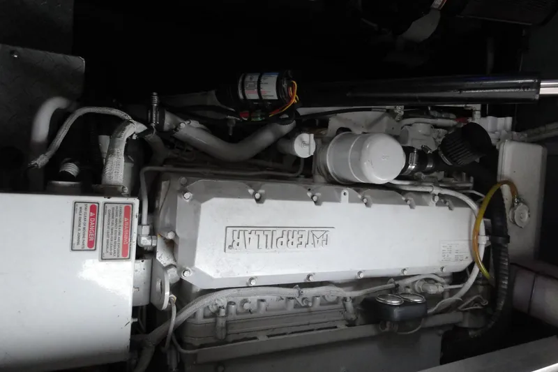 Slide: The Image of Engine compartment of a 2002 Sea Ray 380 Sundancer boat. - 54