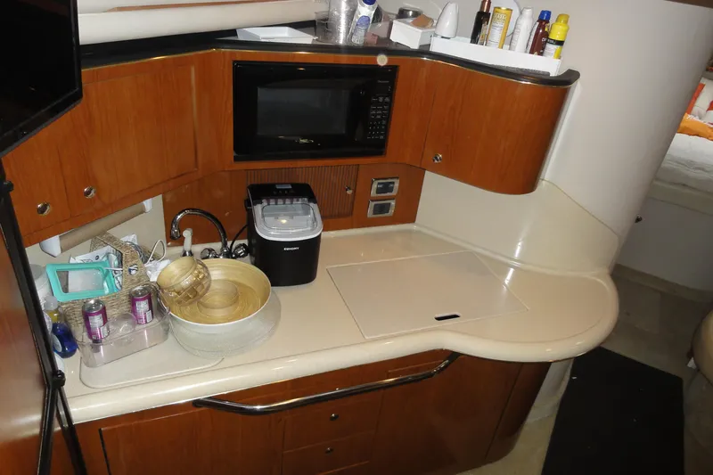 Slide: The Image of Interior galley of 2002 Sea Ray 380 Sundancer with microwave and countertop. - 58