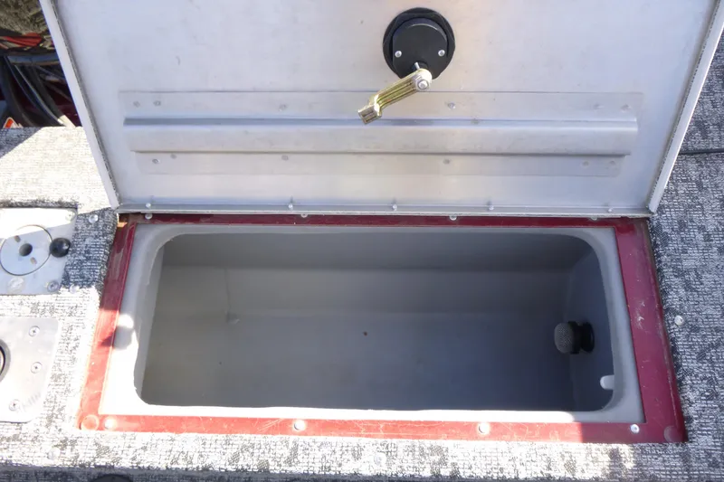 Slide: The Image of Open storage compartment in 2019 Tracker Pro Guide V-175 WT boat. - 13