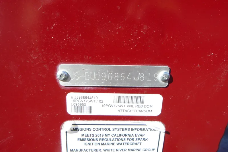 Slide: The Image of 2019 Tracker Pro Guide V-175 WT boat identification plate on red surface. - 16