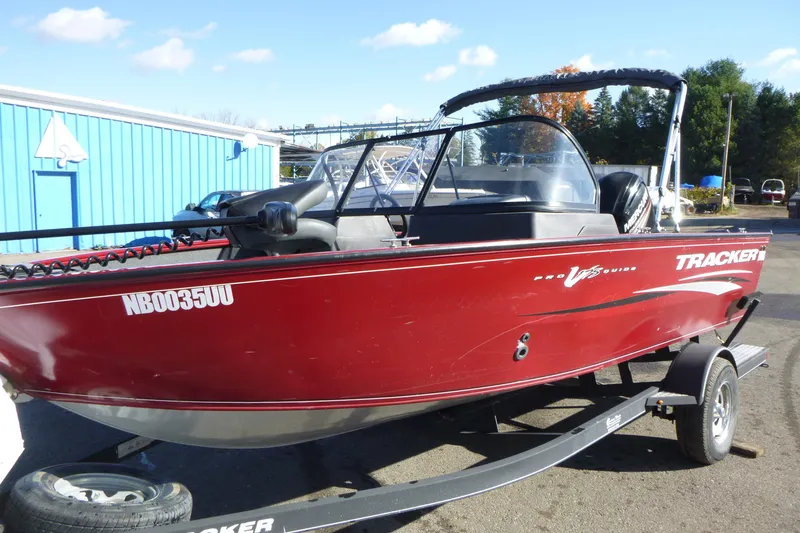 Slide: The Image of 2019 Tracker Pro Guide V-175 WT boat with Mercury outboard motor on trailer. - 2