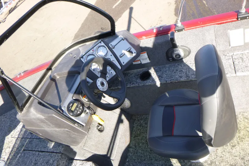Slide: The Image of 2019 Tracker Pro Guide V-175 WT boat cockpit with steering wheel and seat. - 9