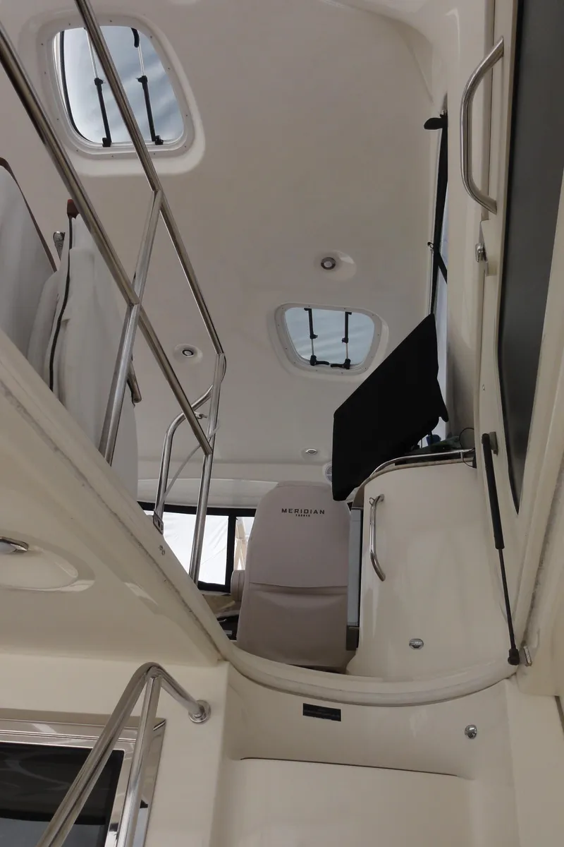 Slide: The Image of Interior view of 2009 Meridian 441 Sedan yacht, featuring sleek design and modern amenities. - 11