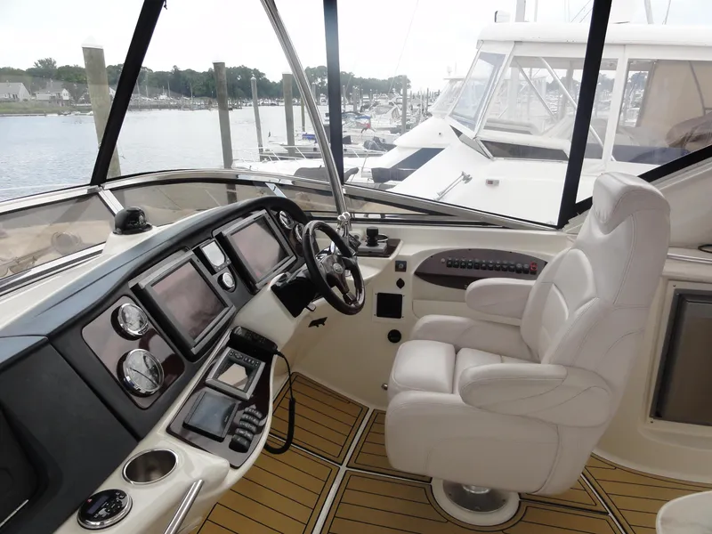 Slide: The Image of 2009 Meridian 441 Sedan helm with modern controls and comfortable captain's chair. - 15